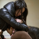Relatives of a victim hug as they wait at a hospital where injured people of a stampede incident are treated.